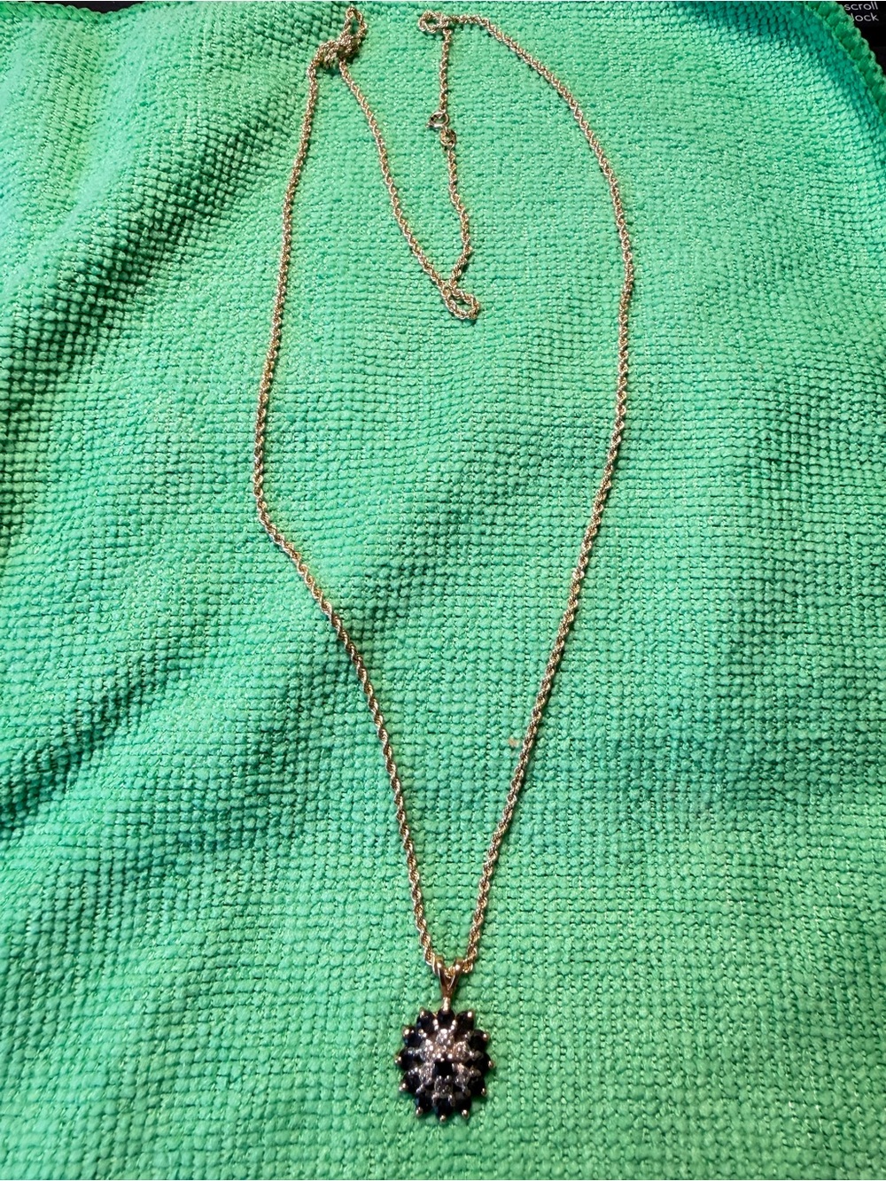14k Gold rope necklace with a 14k gold sapphire and diamond pendant